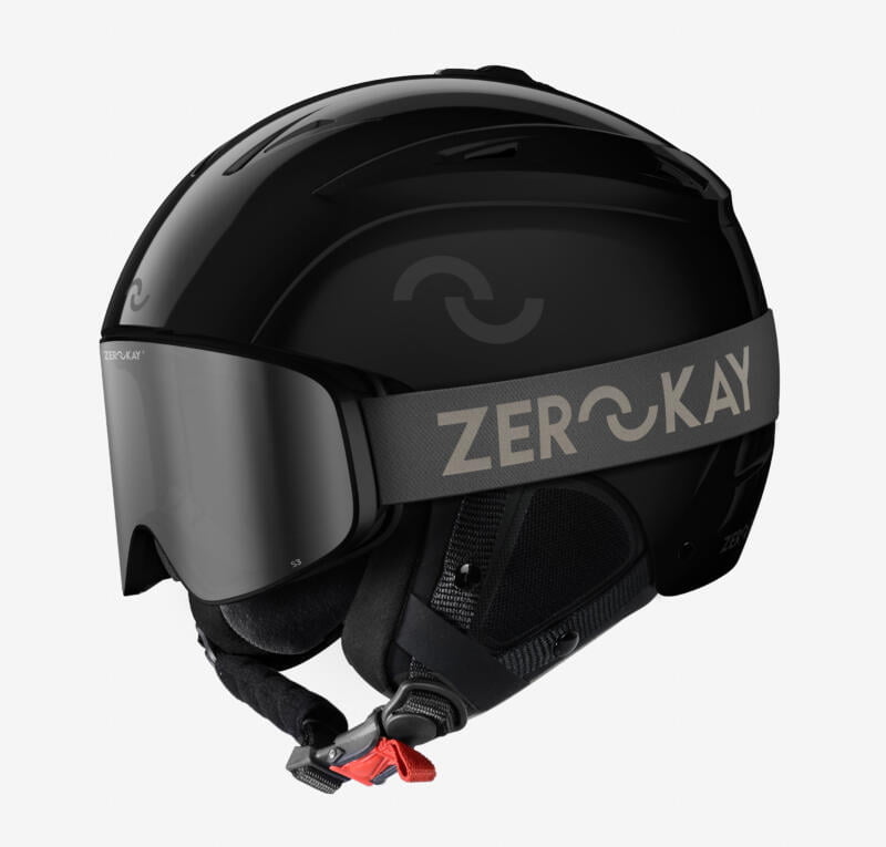 Image depicting the Zerokay Ultra Gloss Ski Helmet in Onyx Black matched with Contrast Ski Goggles, featuring a grey strap and silver mirrored lens, for a sophisticated and functional winter sports ensemble.