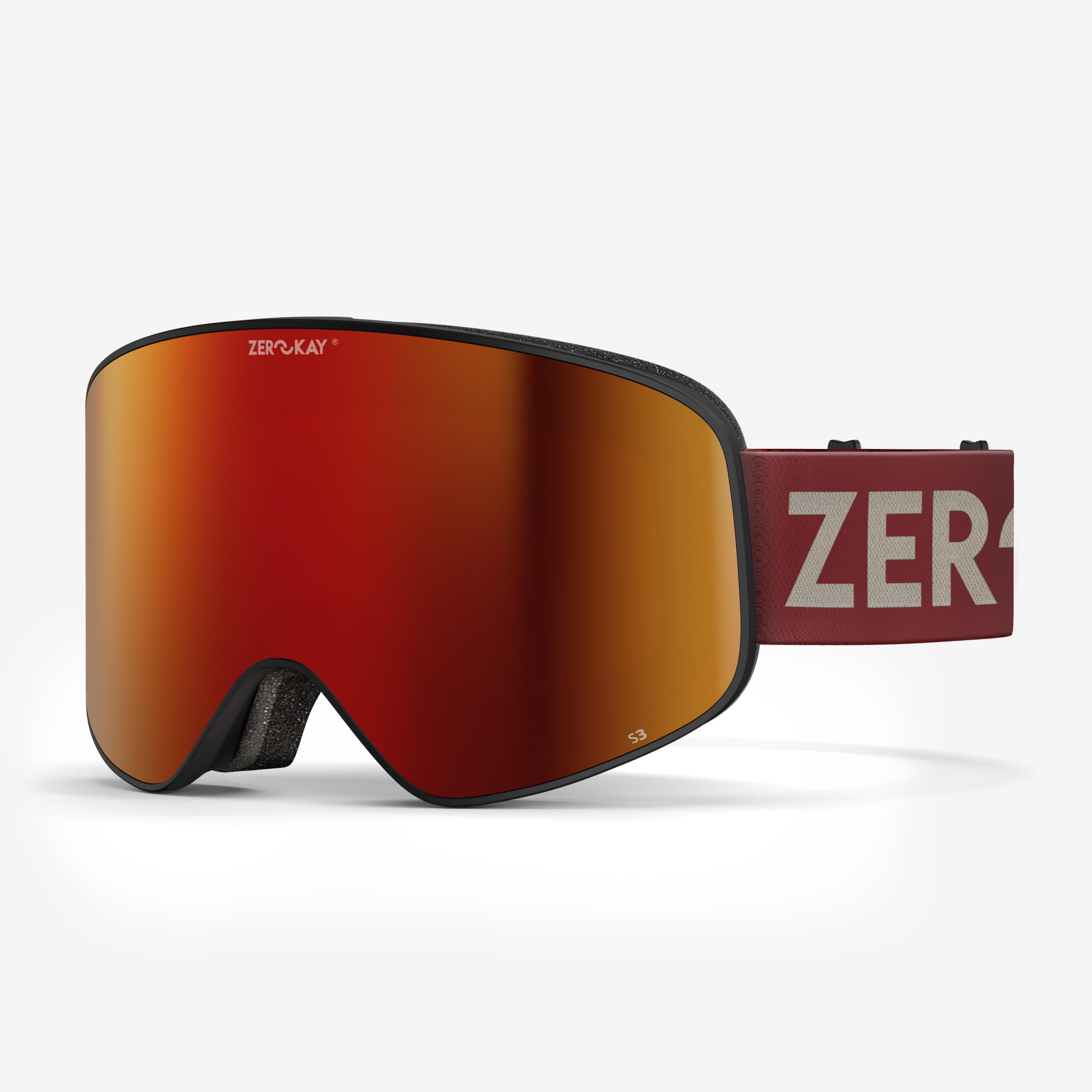 Zerokay Contrast Ski Goggles featuring a red lens and red strap, complete with anti-fog treatment, 3-layer antibacterial foam, and a protective bag for peak performance.